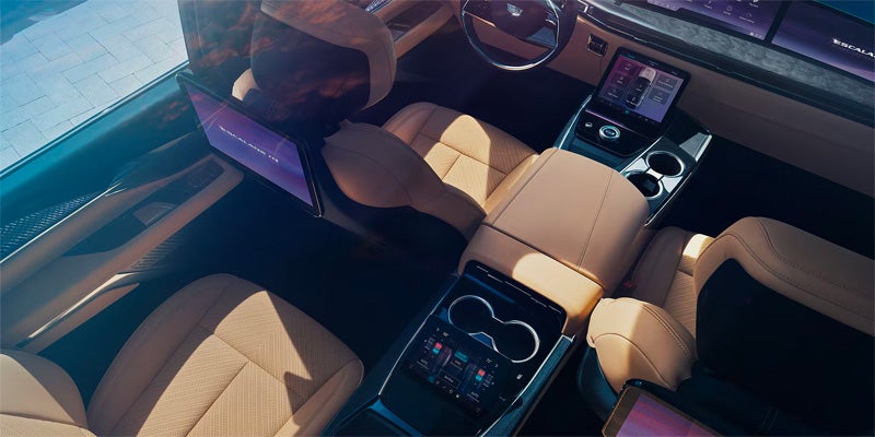 Side profile of a Cadillac Escalade IQ in a dark red finish