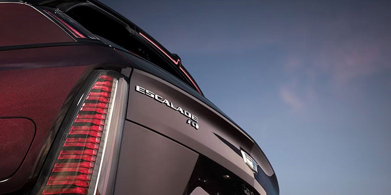 Close-up of the rear Cadillac Escalade IQ badge and taillight