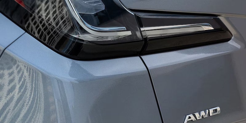 Close-up of the 2025 Cadillac XT4 rear taillight and AWD badge